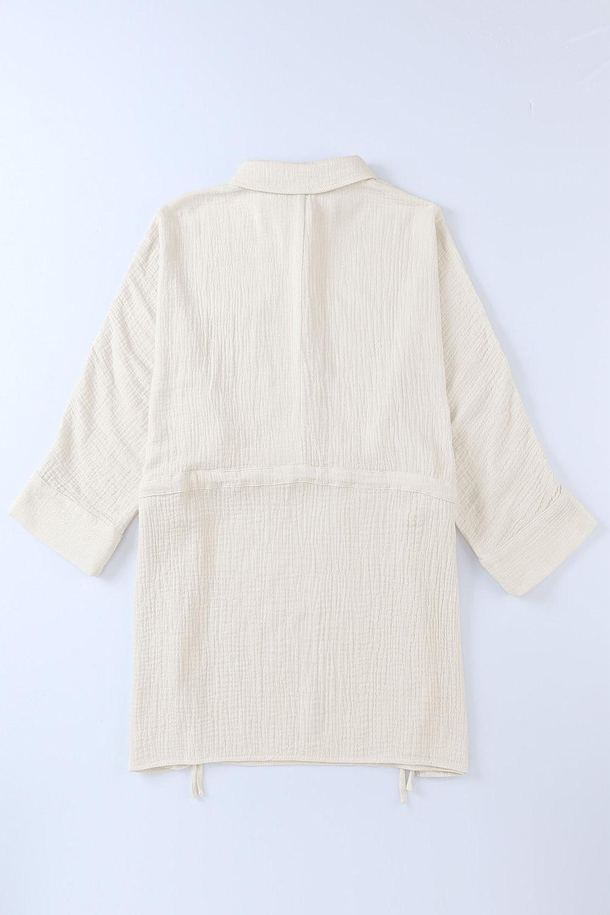 Robe élégante avec boutons et cordon à la taille