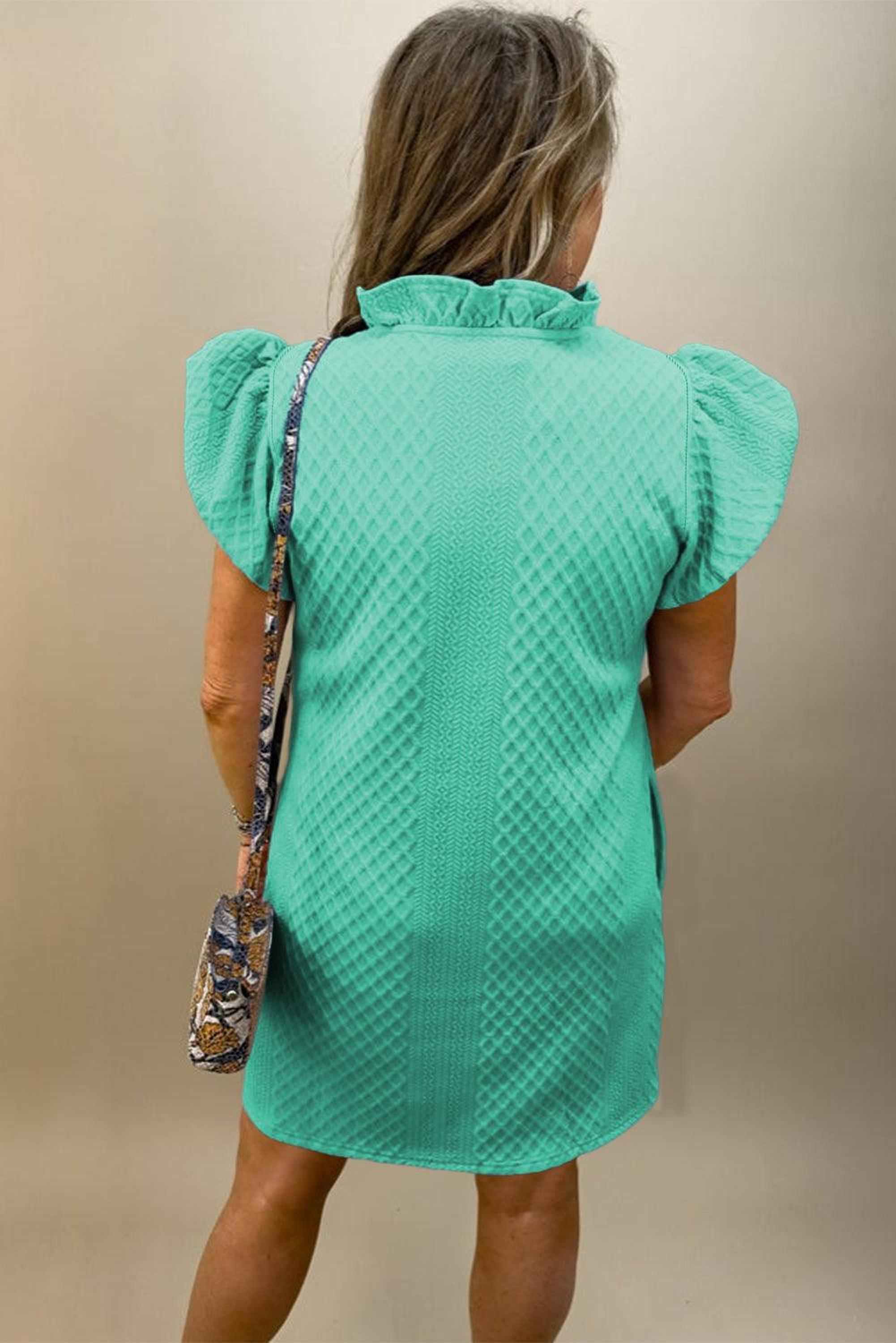 Robe droite structurée avec des manches bouffantes