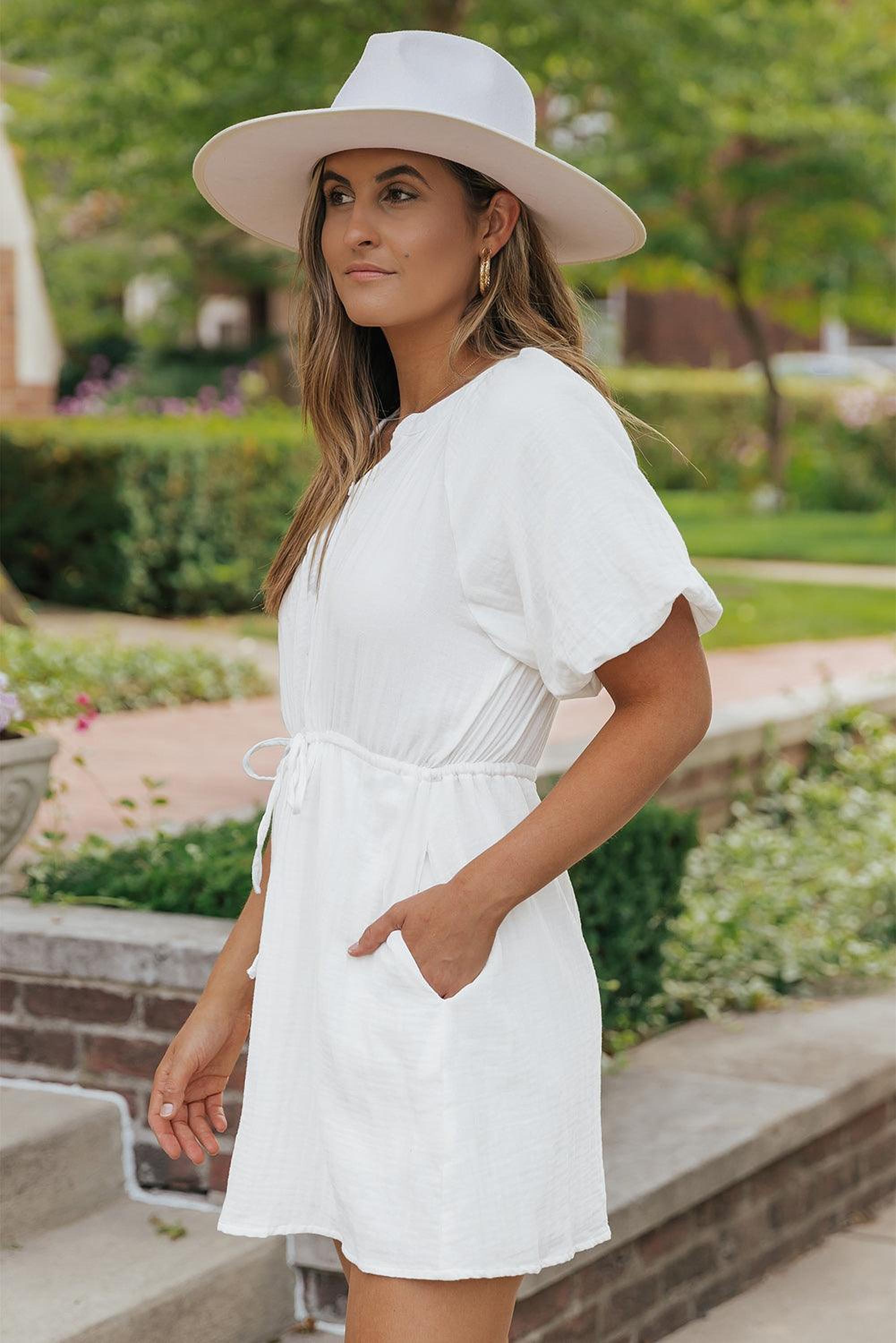 Robe chemise élégante avec manches bouffantes, nœud et poches pour un style pratique
