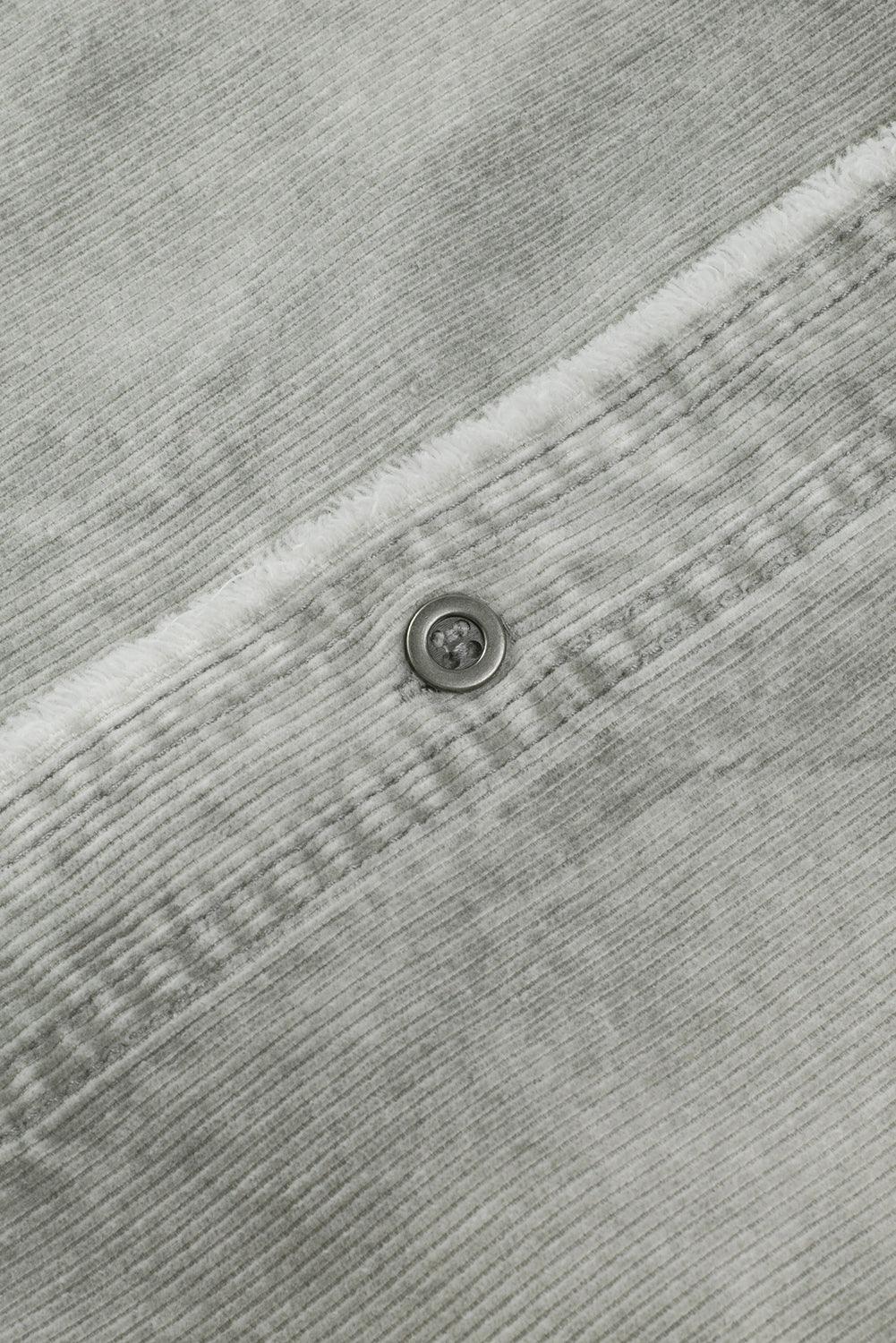 Robe en denim à manches longues avec un ourlet effiloché