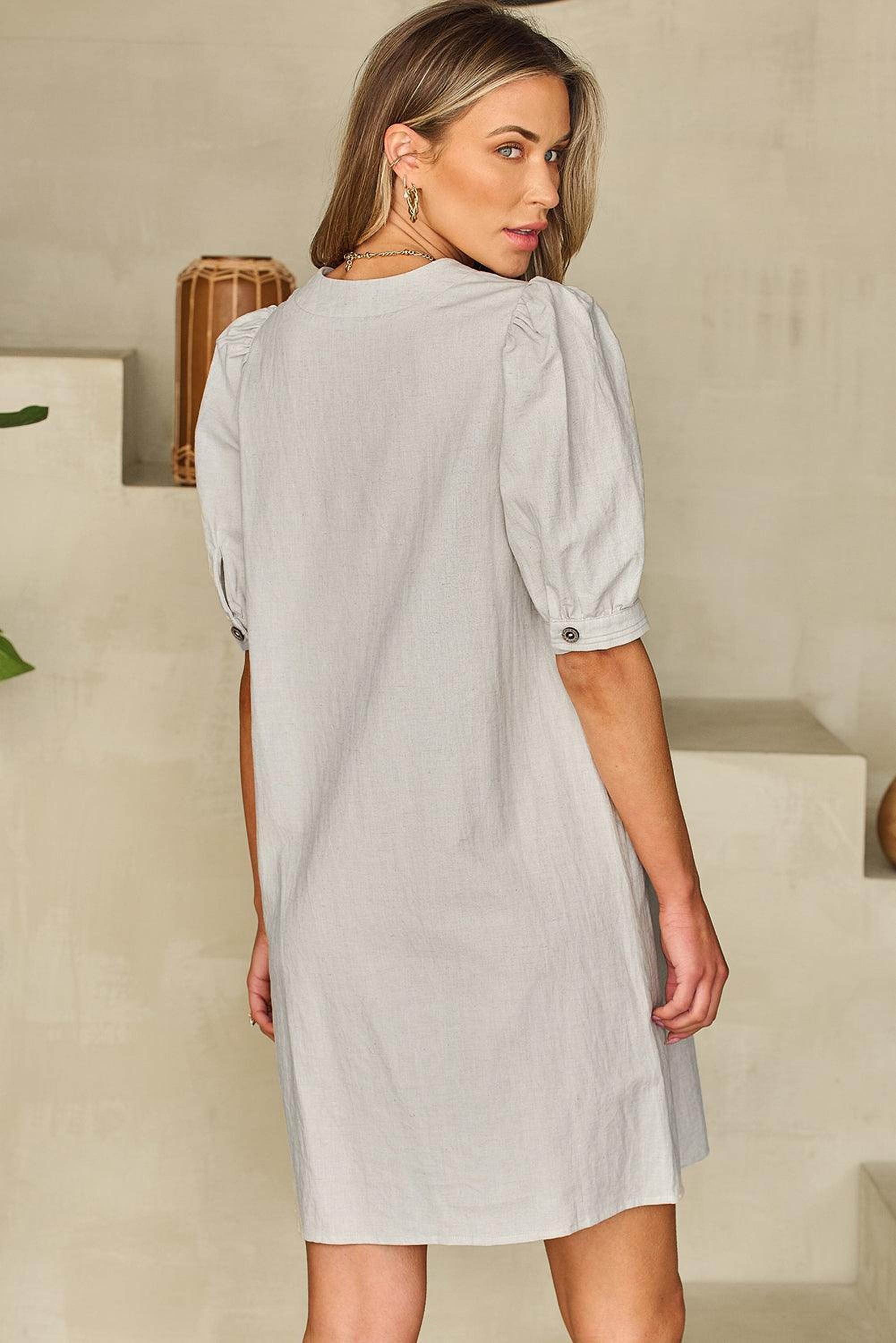 Robe avec un col à nœud et manches bouffantes