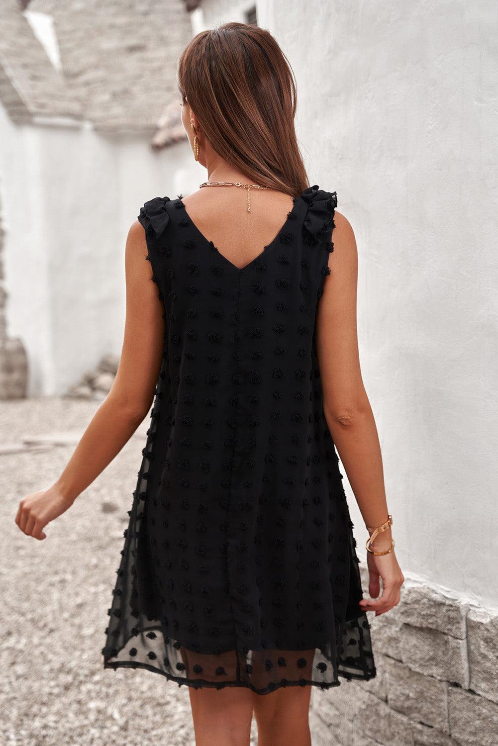 Robe à pois élégante avec col en V et volants