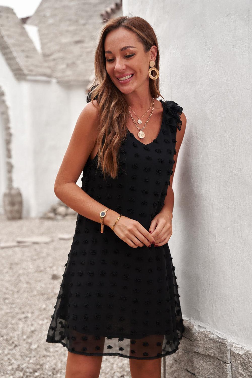 Robe à pois élégante avec col en V et volants