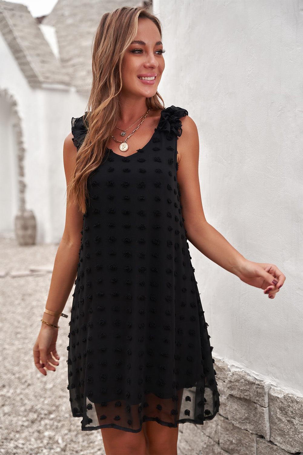 Robe à pois élégante avec col en V et volants