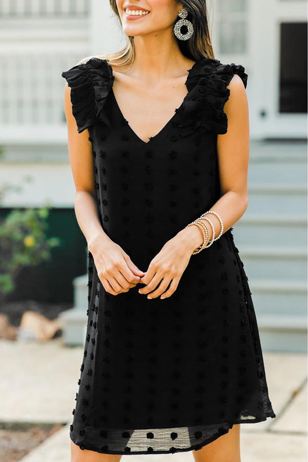 Robe à pois élégante avec col en V et volants