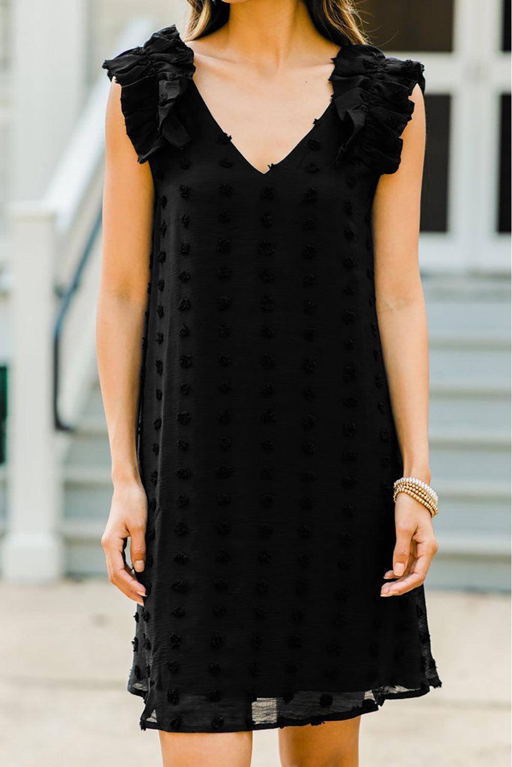 Robe à pois élégante avec col en V et volants