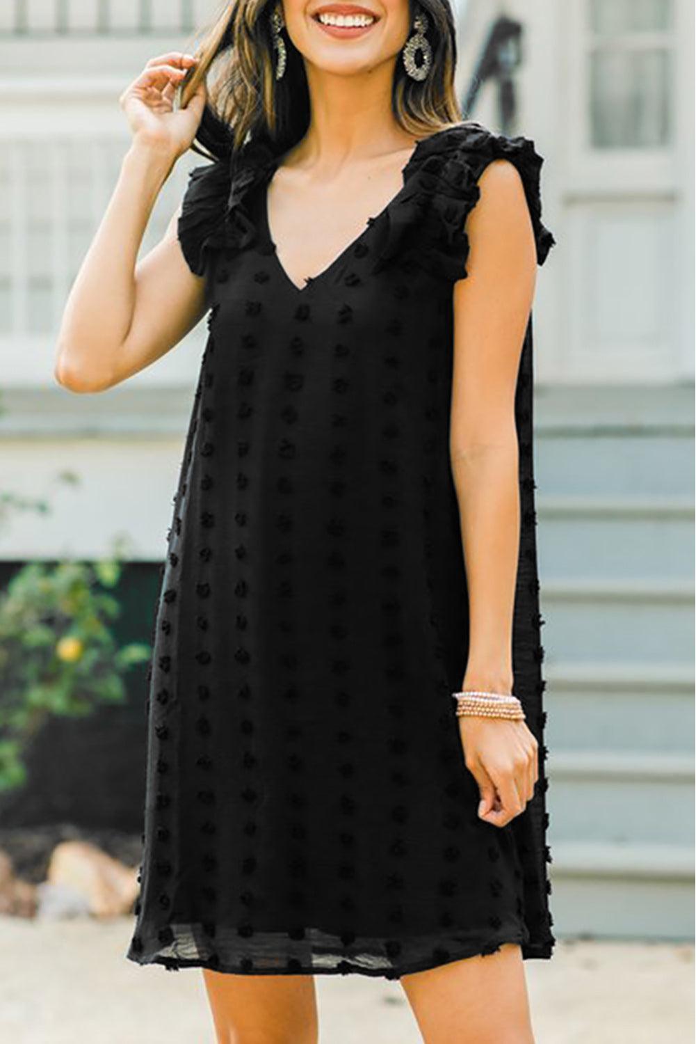 Robe à pois élégante avec col en V et volants
