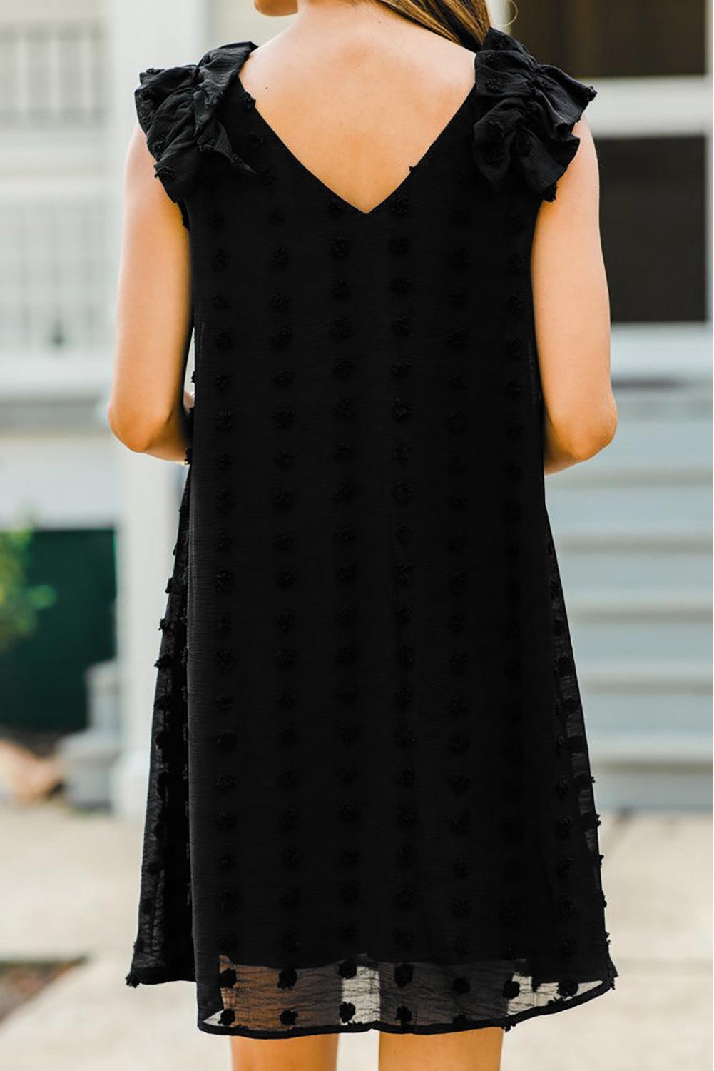 Robe à pois élégante avec col en V et volants